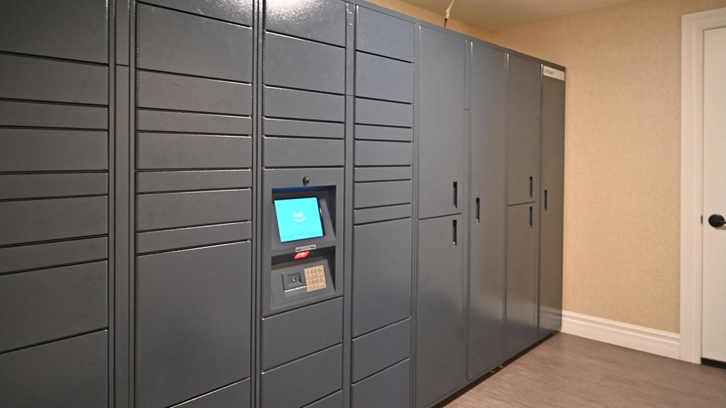 a row of gray lockers with a screen on the door