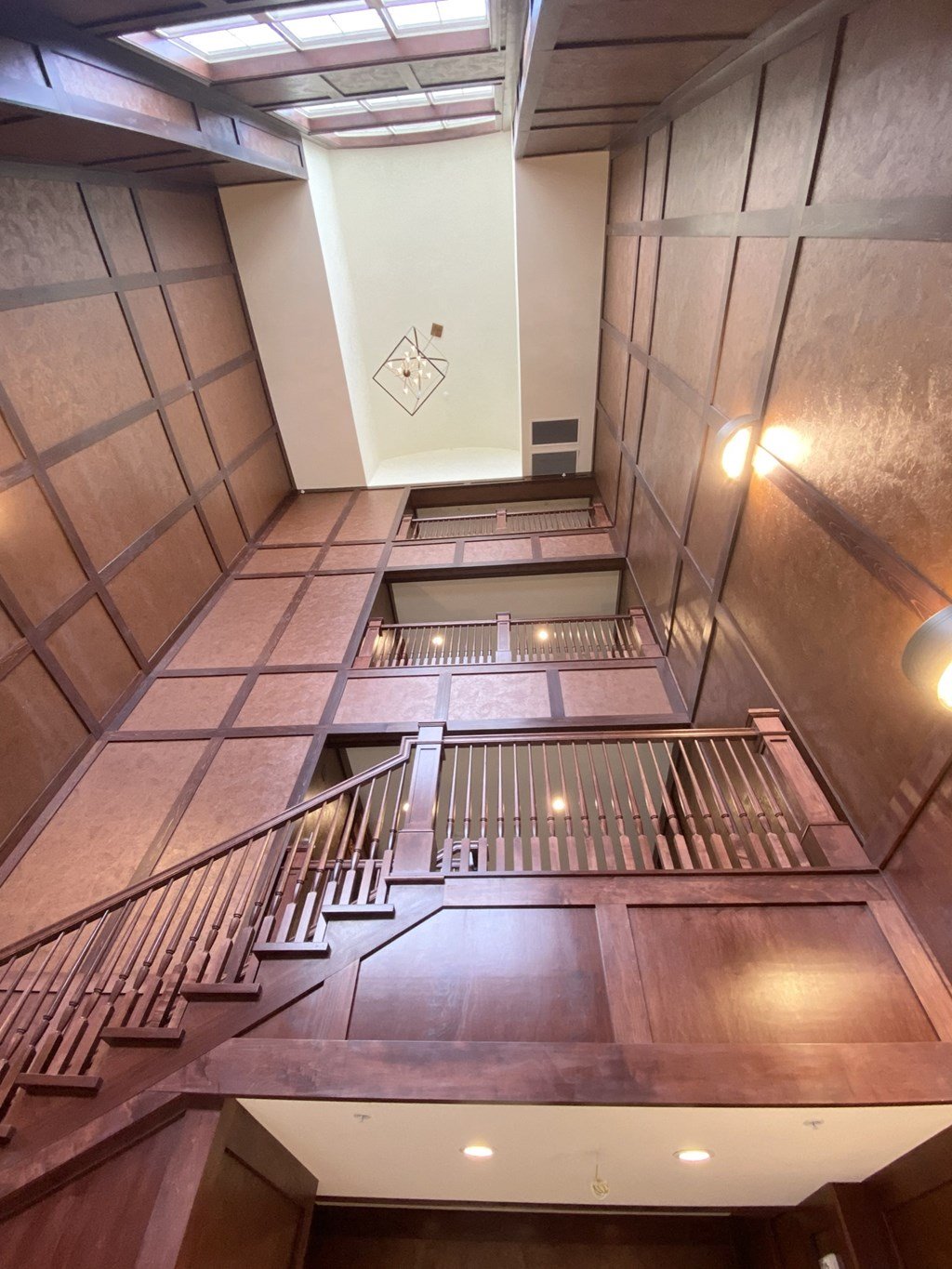 a view of the stairs in a building from above