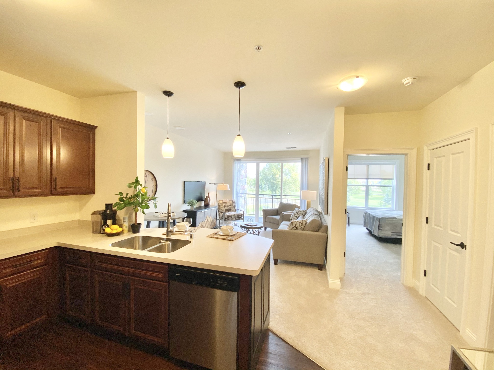 the view from the kitchen into the living room of a new home