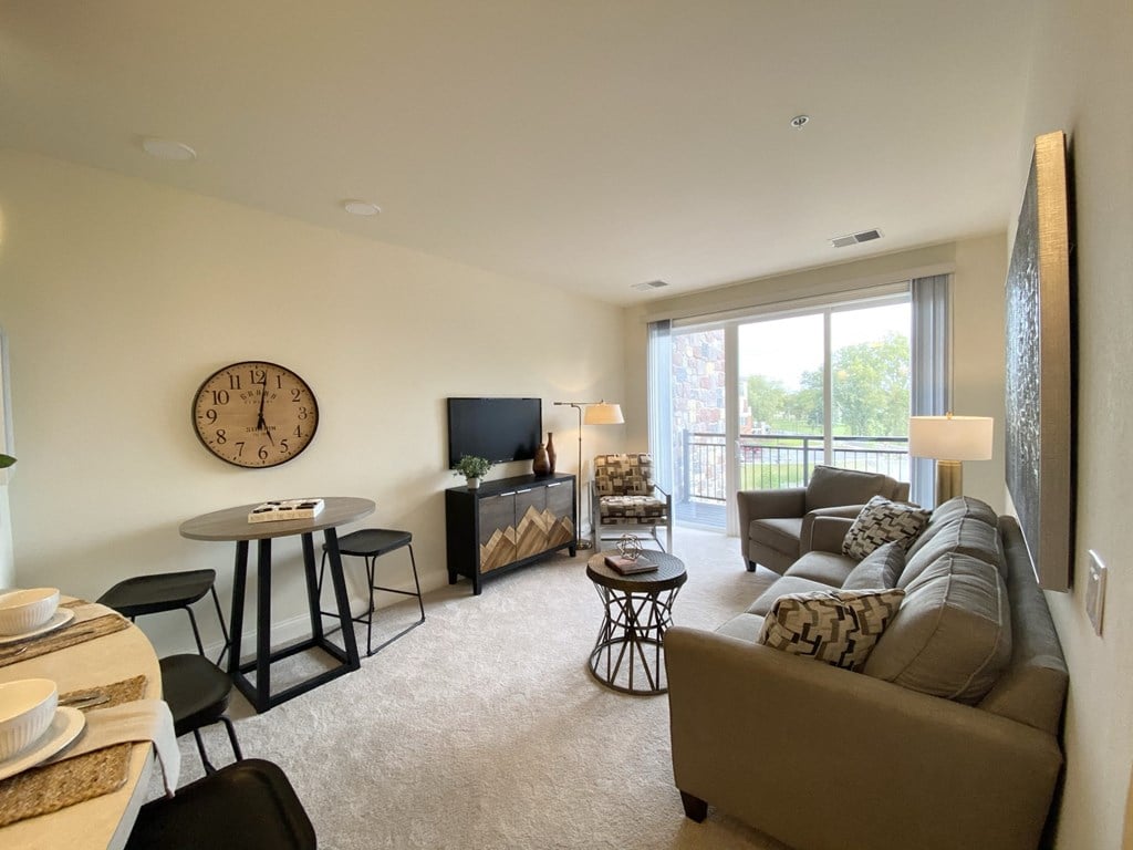 a living room with a couch and a table and a tv