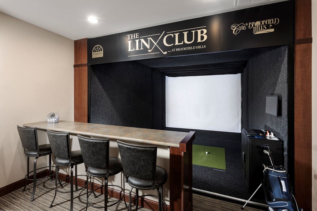 a meeting room with a table and chairs