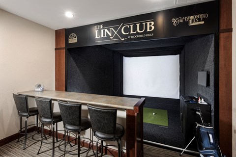 a meeting room with a table and chairs