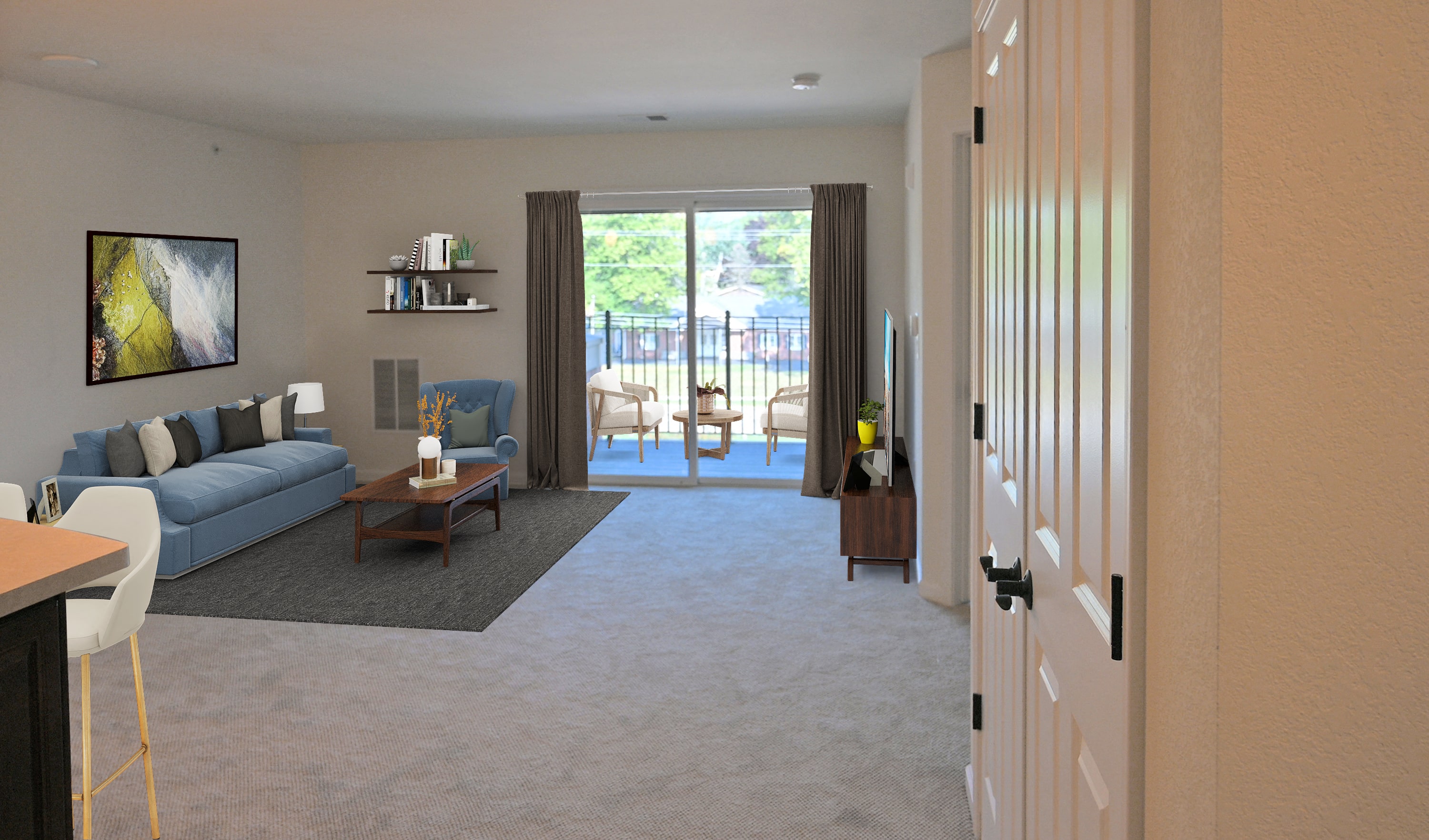 a living room with a couch and a door to a patio
