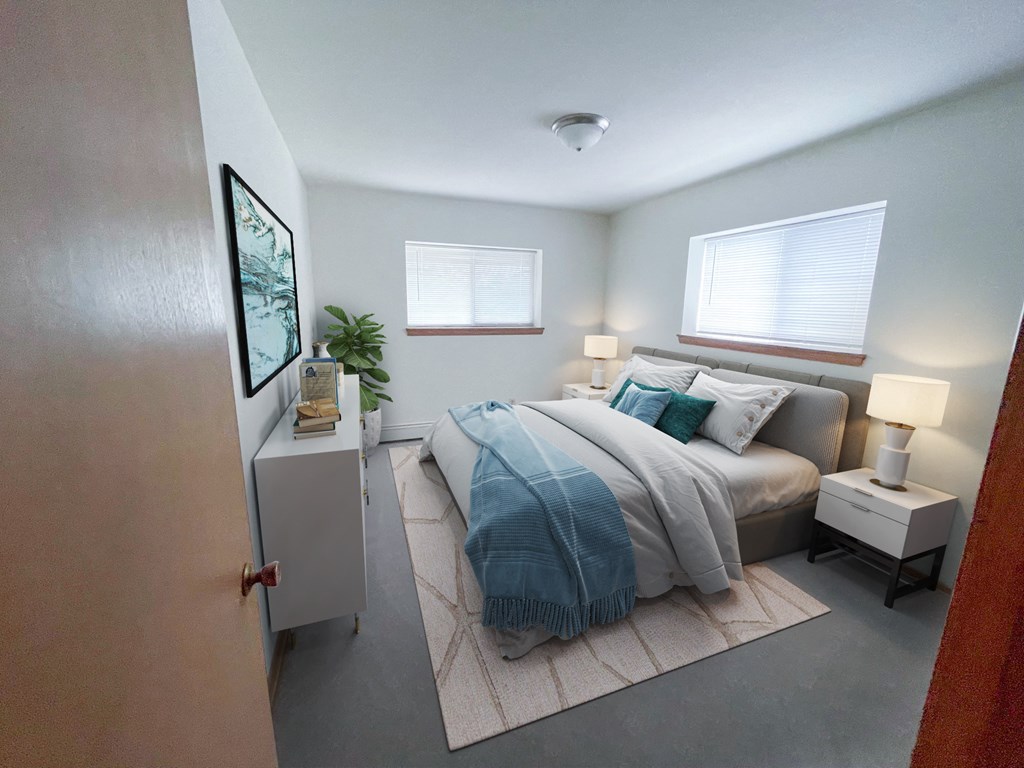 a bedroom with a bed and two windows