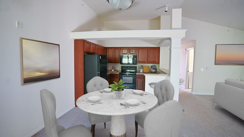 a kitchen and dining room with a white table and chairs