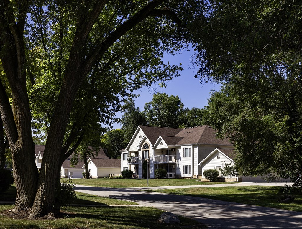 a group of houses on the side of a street