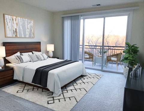 a bedroom with a bed and a sliding glass door