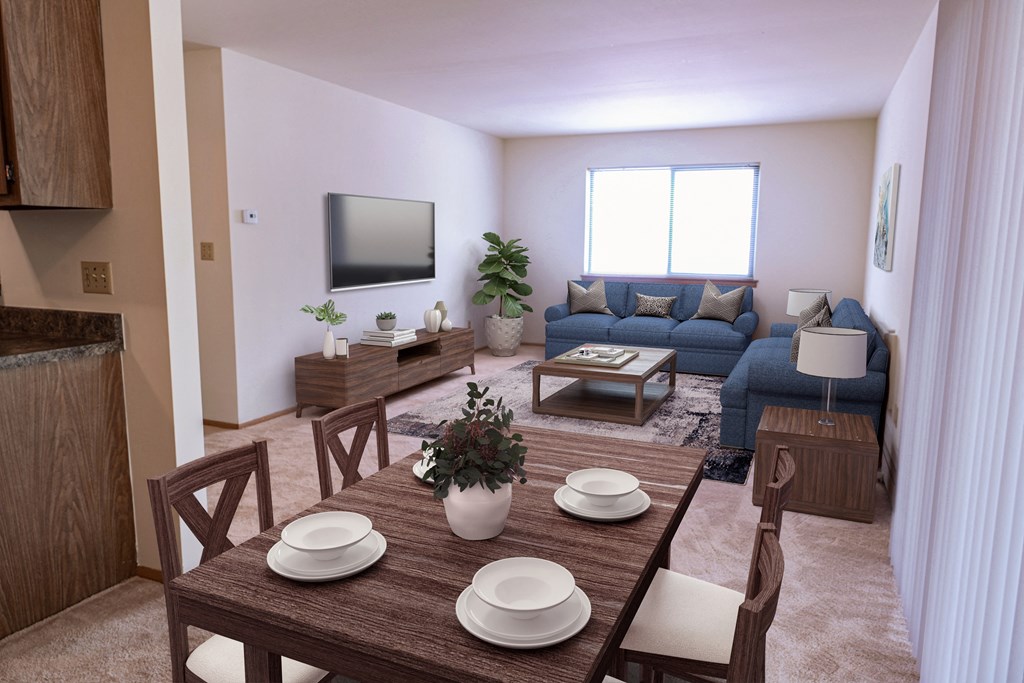 a living room and dining room with a table and chairs