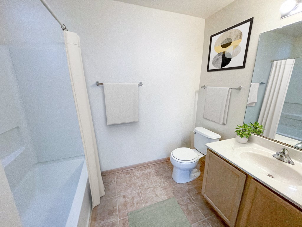 a bathroom with a toilet and a sink and a shower