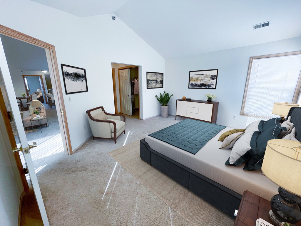 a bedroom with a bed and a mirror in a house