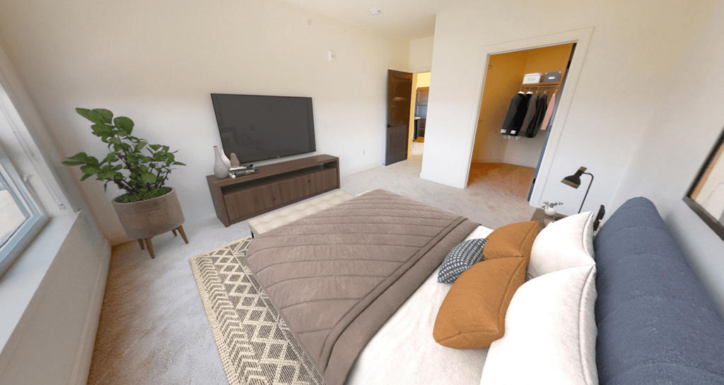 a living room with a couch and a tv