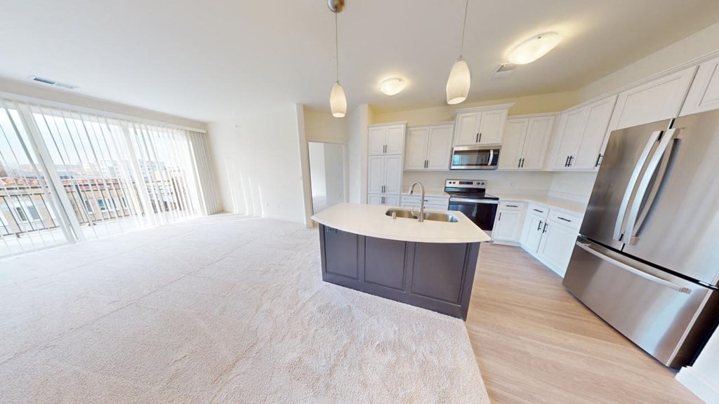 a kitchen with a counter top in a empty room