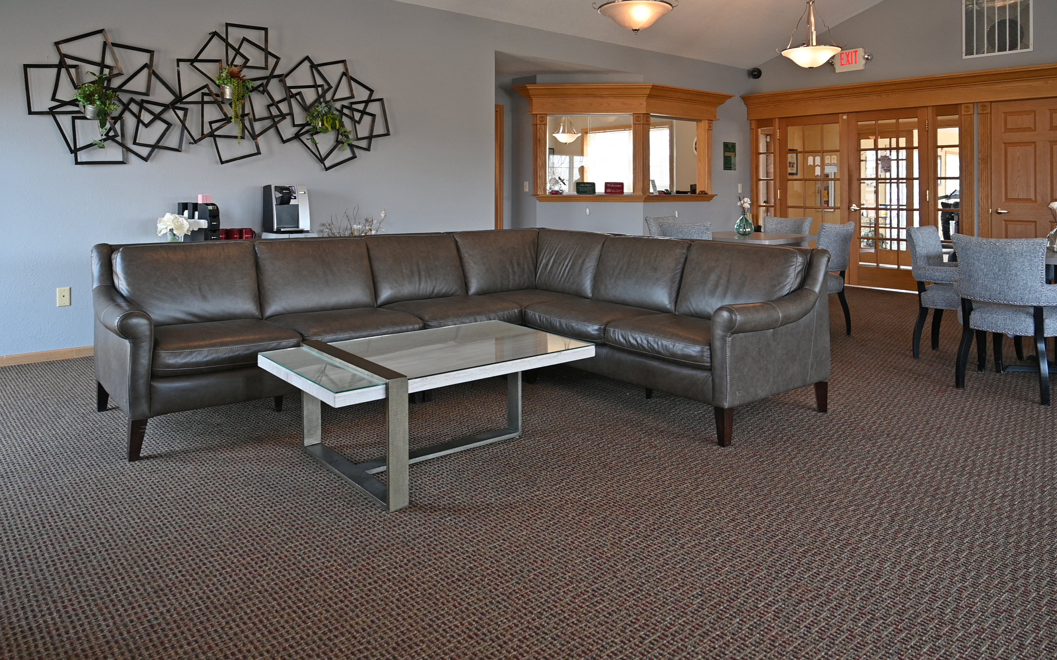a living room with a leather couch and a coffee table