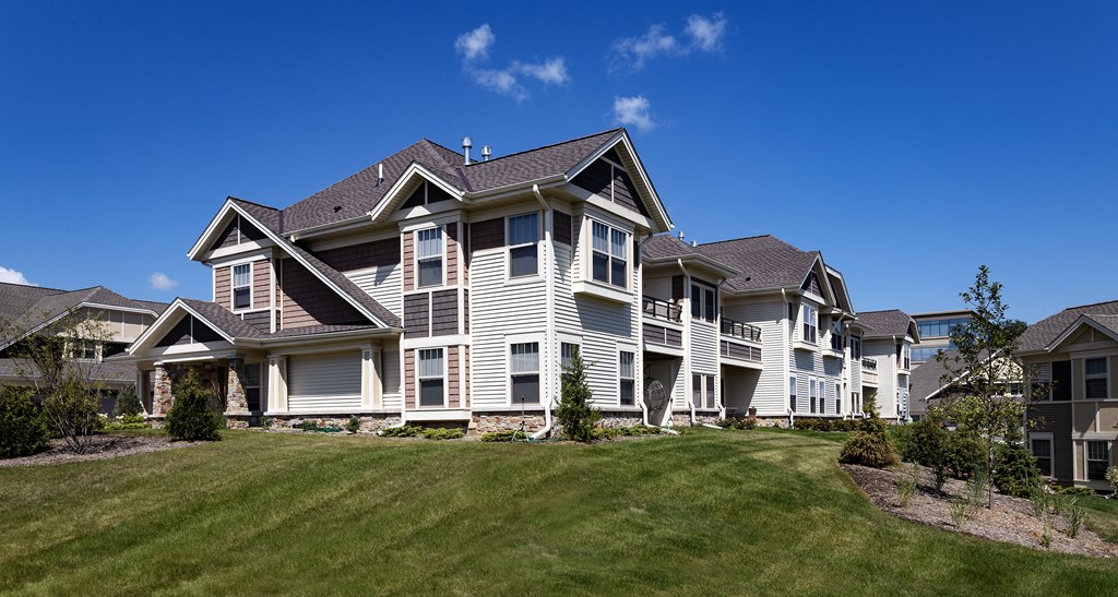 a large house with a yard in front of it