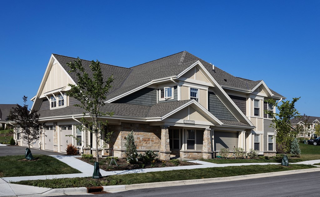 a large house with a street in front of it