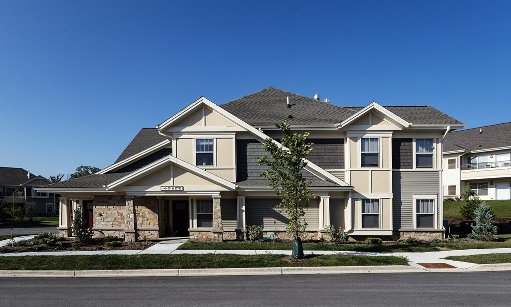 a large house with a street in front of it