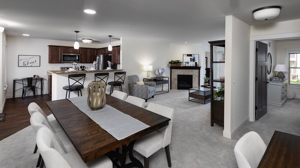 a large living room and dining room with a table and chairs