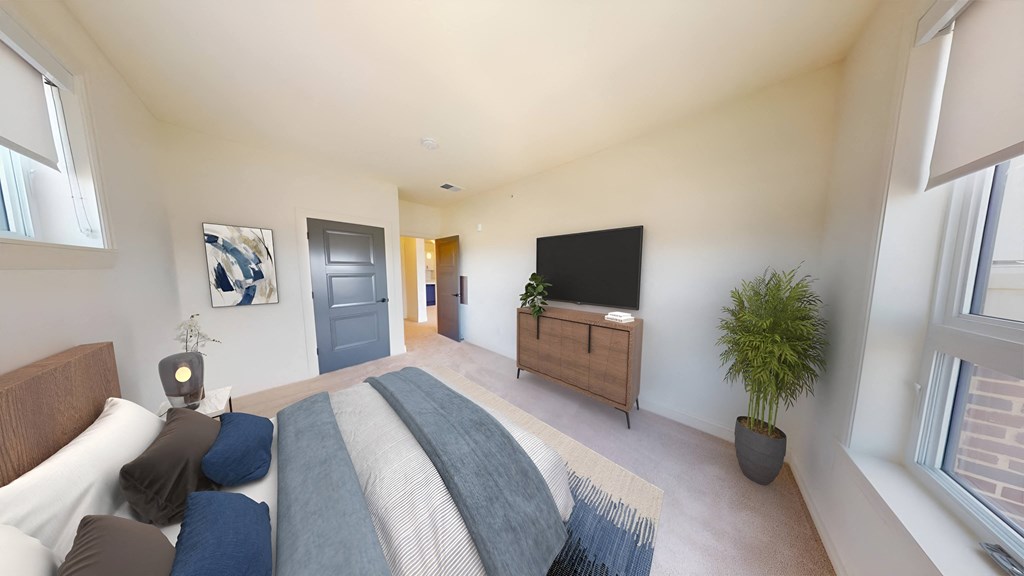 a bedroom with a bed and a tv in a house