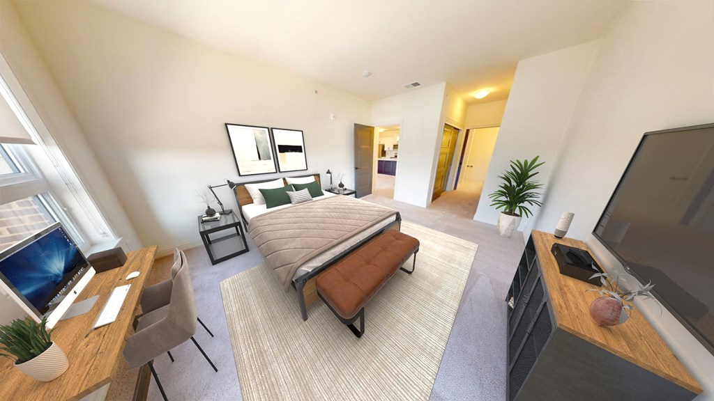 a bedroom with a bed and a tv in a hotel room