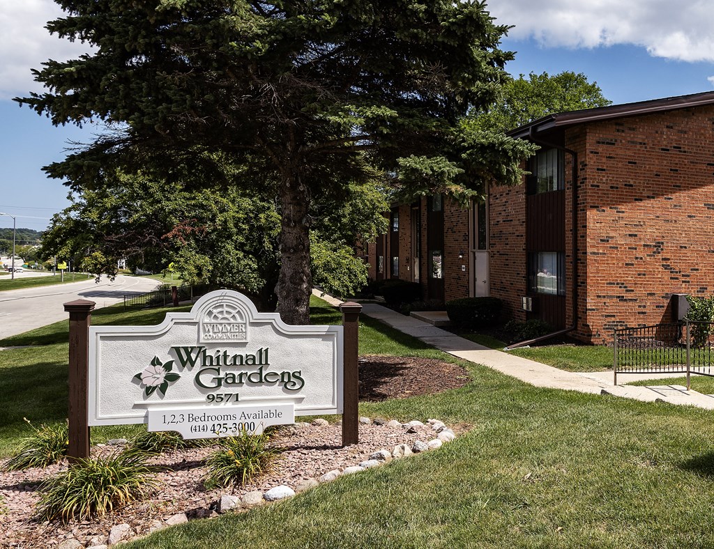 a sign in front of a building that says spiritual gardens