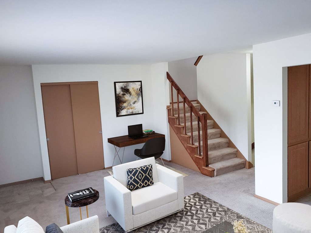 a living room with a staircase in a house