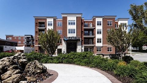 a large brick building with a sign in front of it