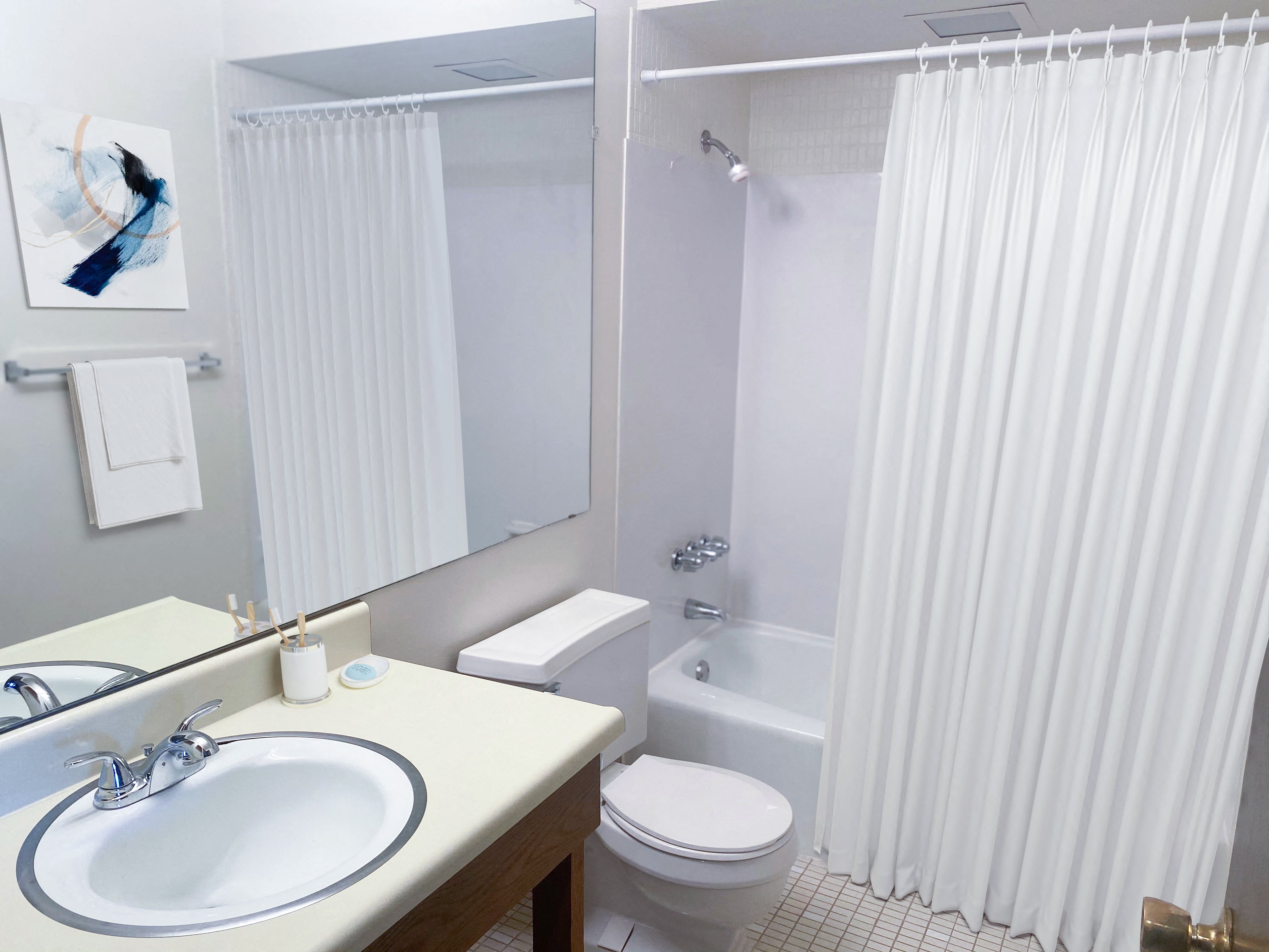 a bathroom with a sink and a toilet and a shower