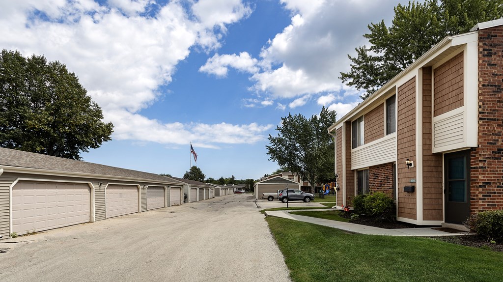 a view of a street in front of a row of houses