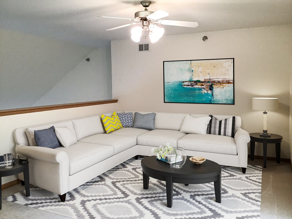 a living room with a white couch and a coffee table