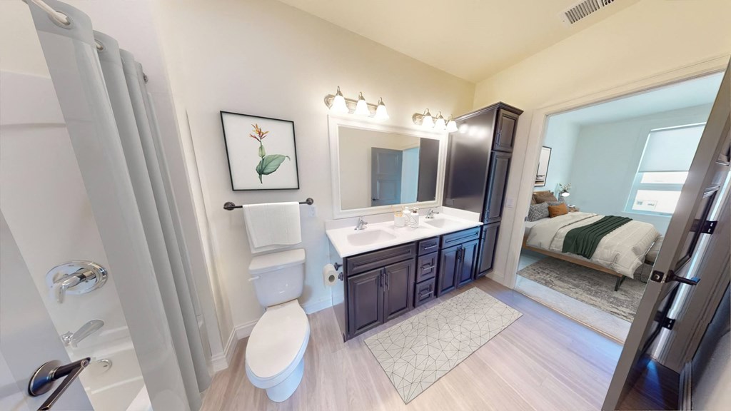 a bathroom with a toilet and a sink and a mirror