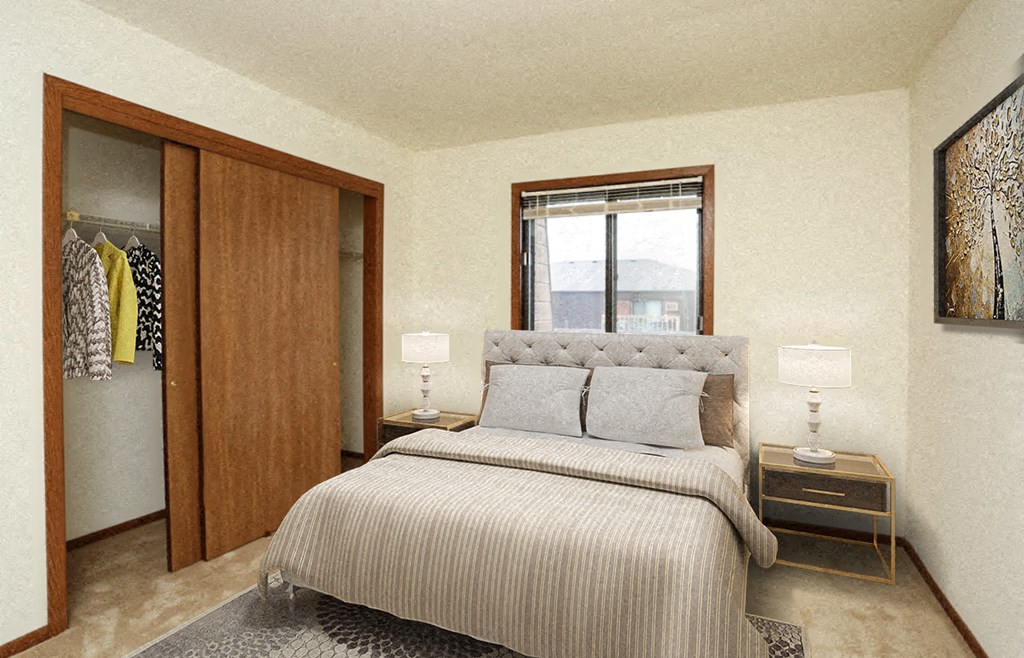 a bedroom with a bed and closet and a window