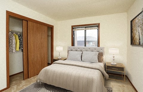 a bedroom with a bed and closet and a window