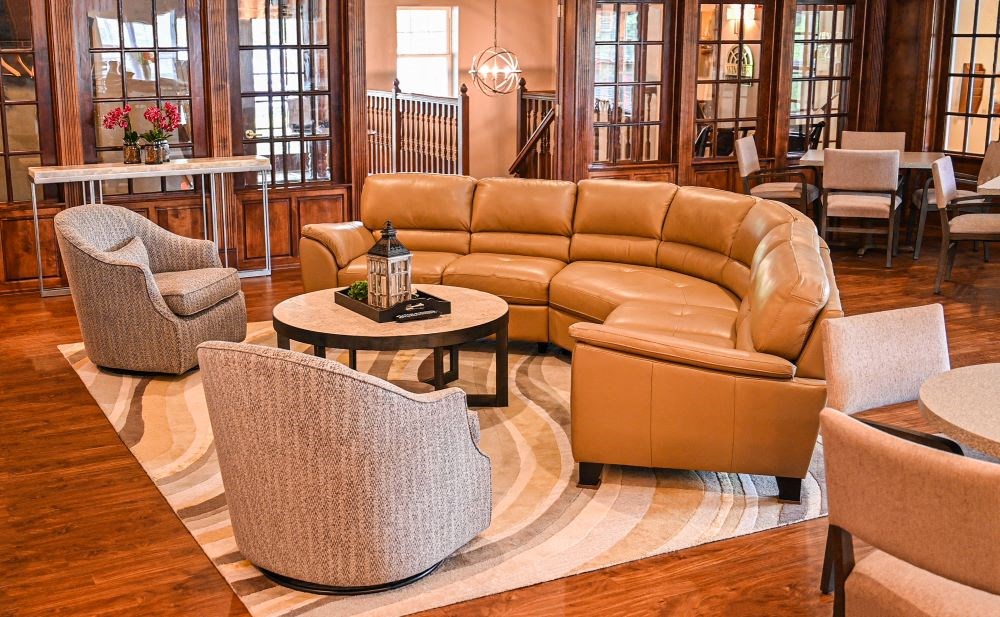 a living room filled with furniture and a rug