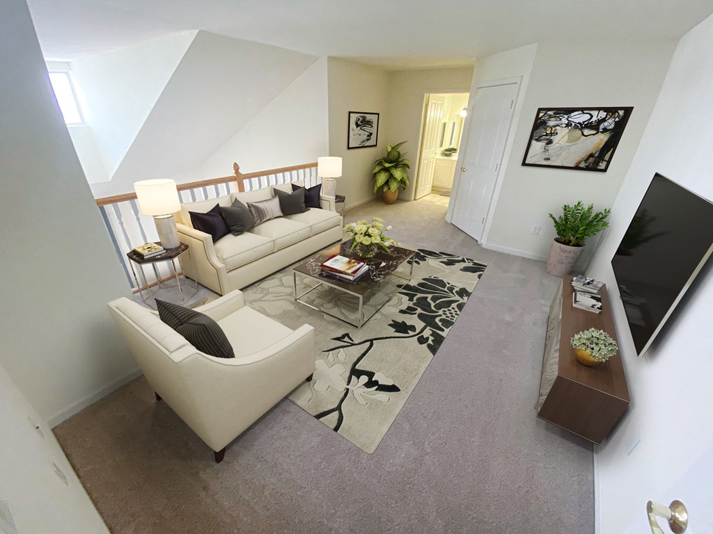 a view of the living room from the loft