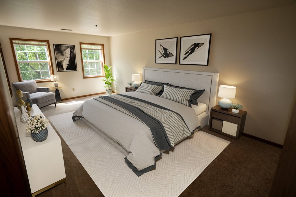 a bedroom with a bed and a chair and a table