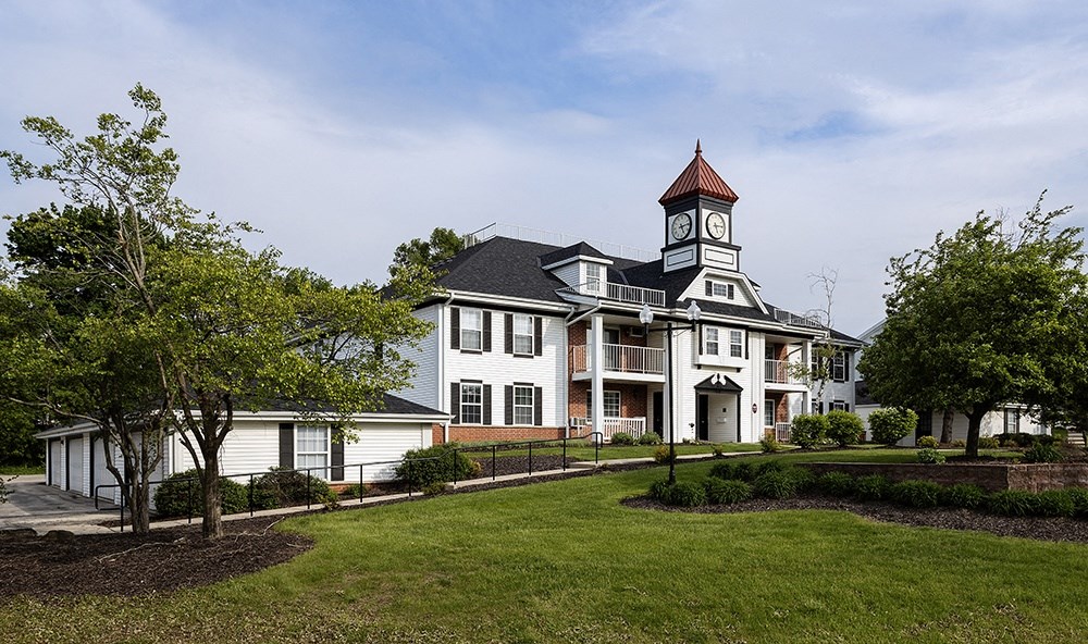 a large house with a clock tower on top of it