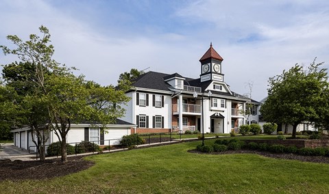 a large house with a clock tower on top of it