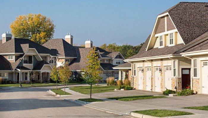 a row of houses on a street a row of houses on a street at Falcon Glen Apartments, Wisconsin