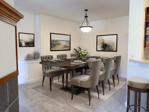 a dining room with a table and chairs