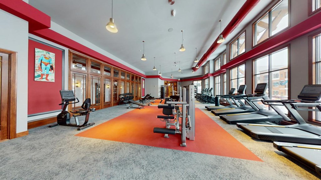 A gym with treadmills and exercise bikes.