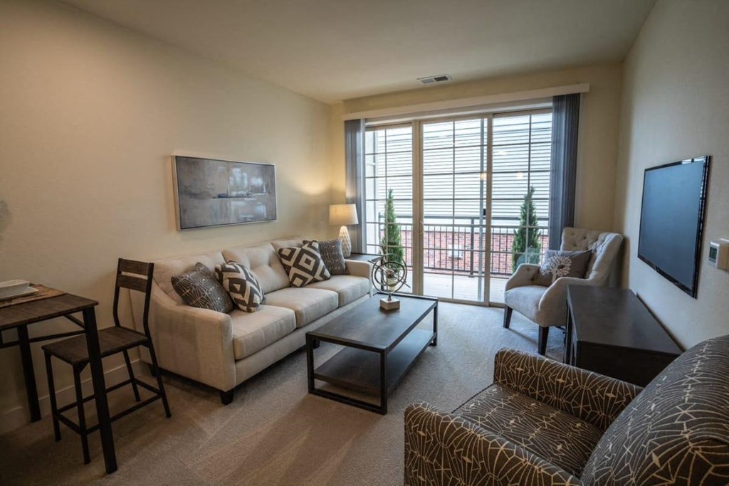 a living room with a couch and a table