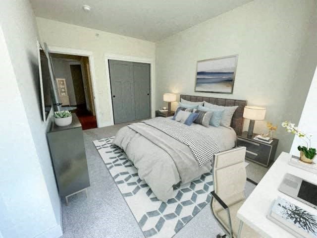 a bedroom with a bed and a tv