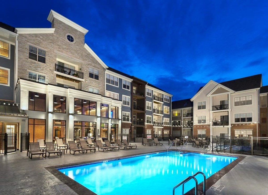 a swimming pool in the middle of an apartment building