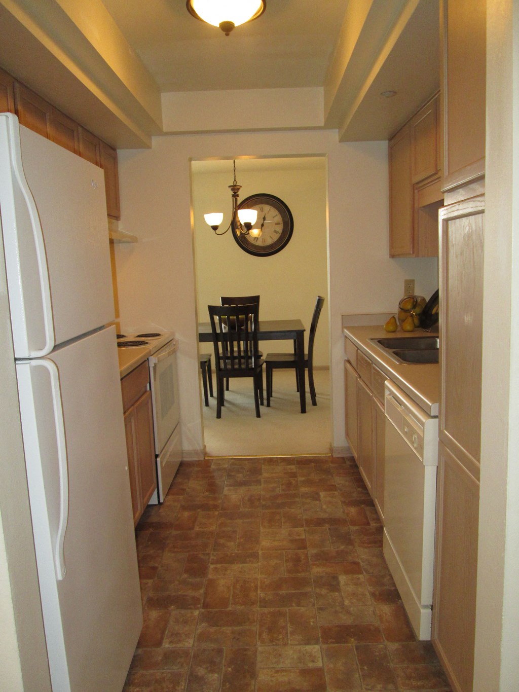 this is a photo of the kitchen and dining room of a 1 bedroom apartment at deer hill