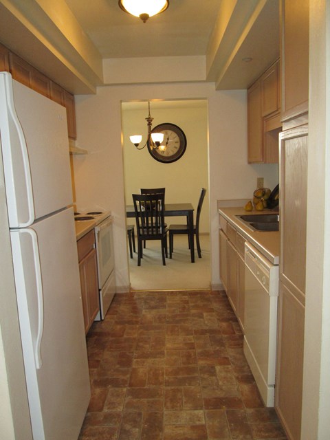 this is a photo of the kitchen and dining room of a 1 bedroom apartment at deer hill