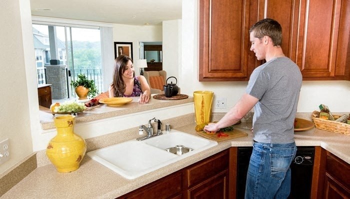 a man and a woman in a kitchen