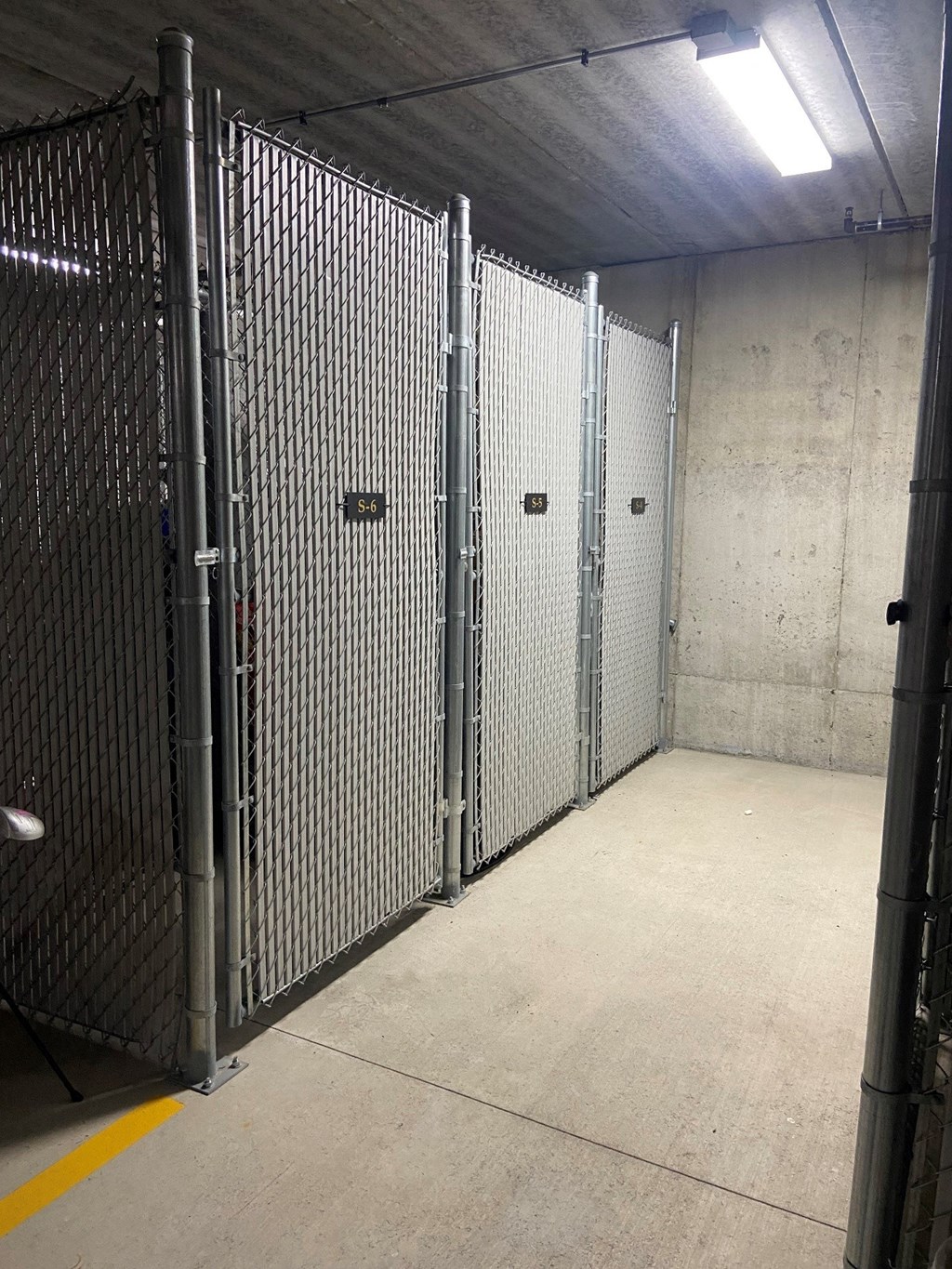 a row of prison doors in a building