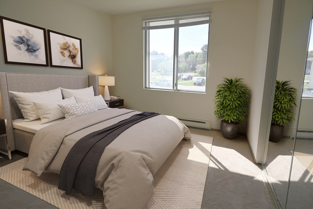 a bedroom with a large bed and a window