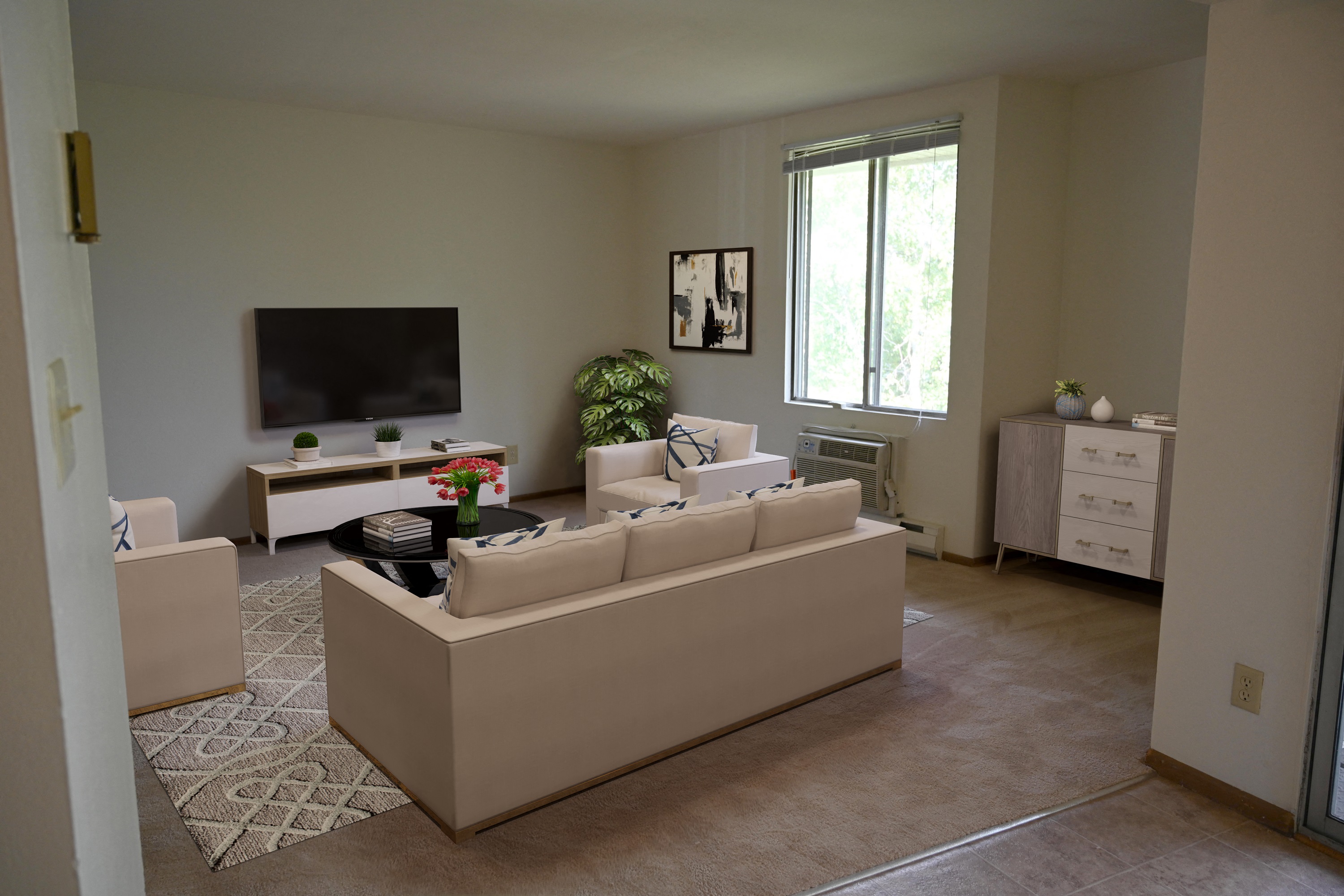 a living room with a couch and a tv