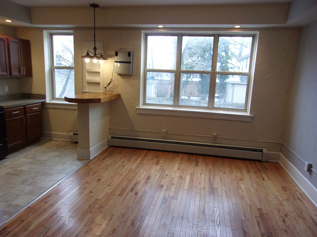 an empty living room with a large window